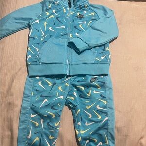 Nike Turquoise Jacket and pants with Swoosh Design